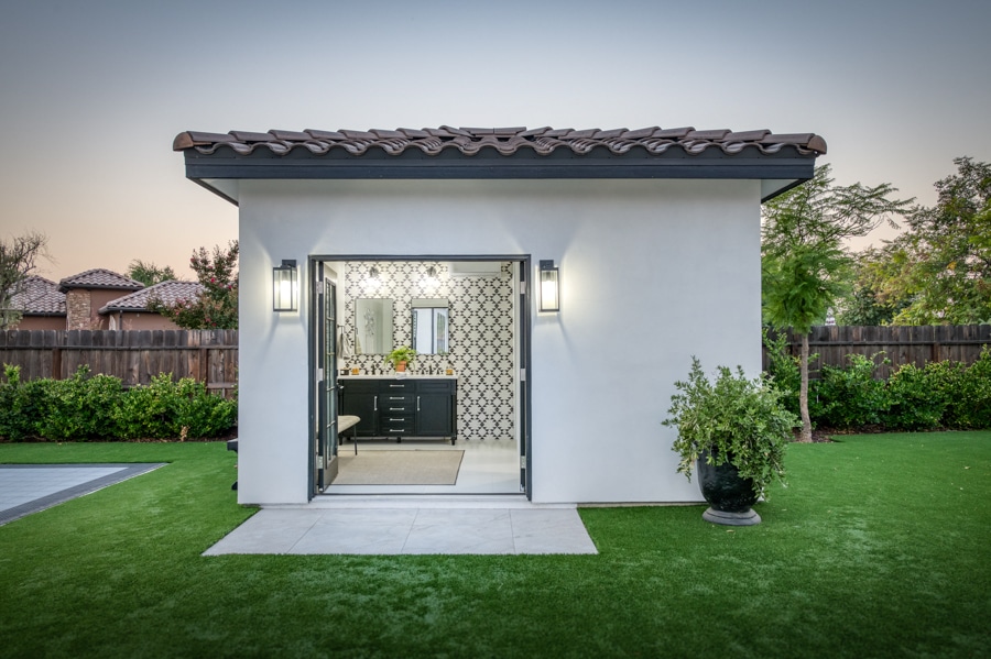 14x12 outdoor bath house with double doors open to double vanity