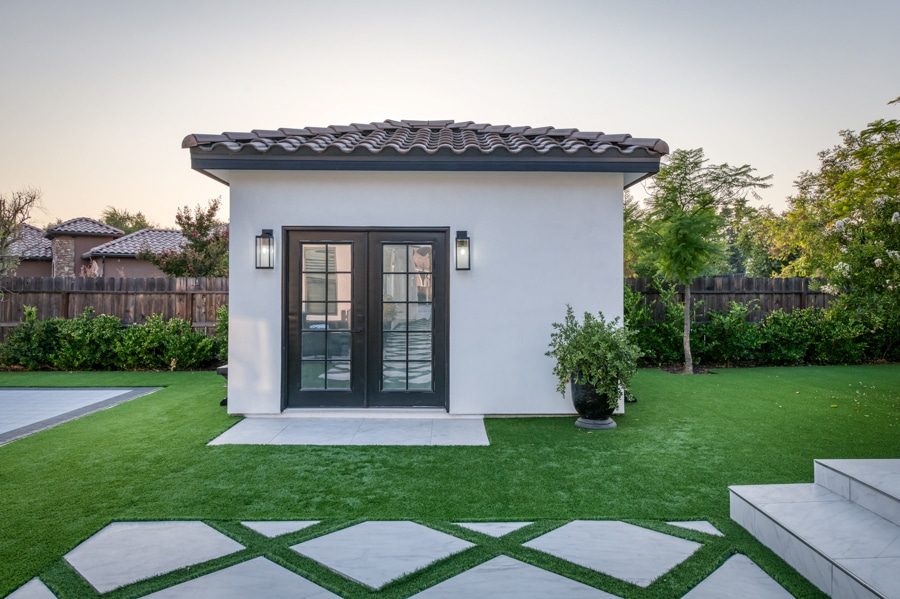14x12 outdoor bath house with french style doors stucco siding and spanish tile roof