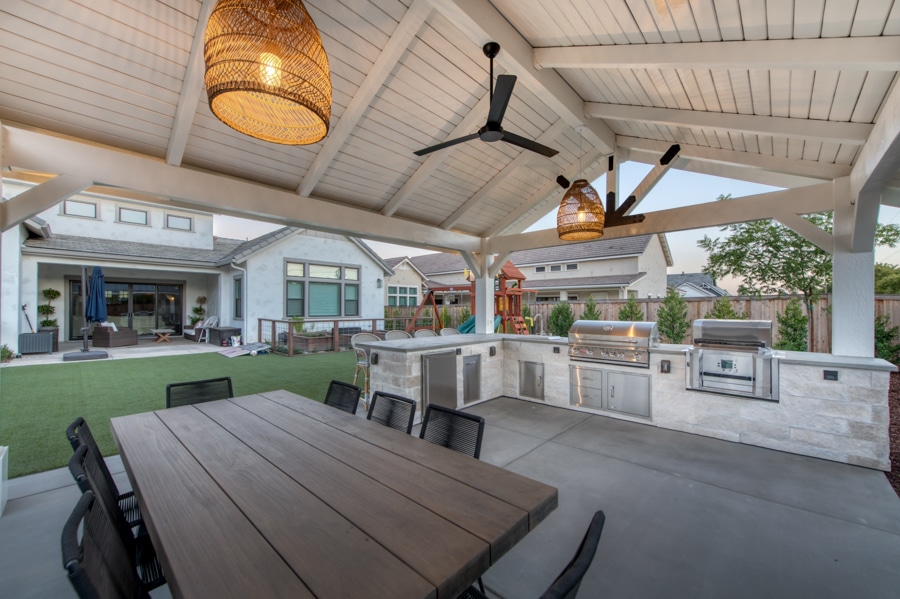 16x20 Timber Frame Pavilion and Patio with lighting on featuring outdoor kitchen and dining table