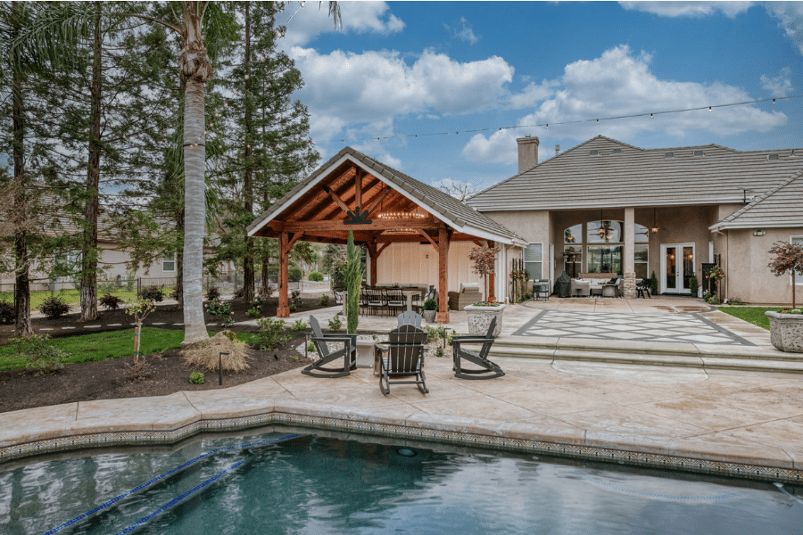 17x23 timber frame pavilion behind house and by pool