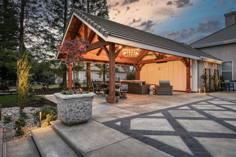17x23 timber frame pavilion lit up at sunset