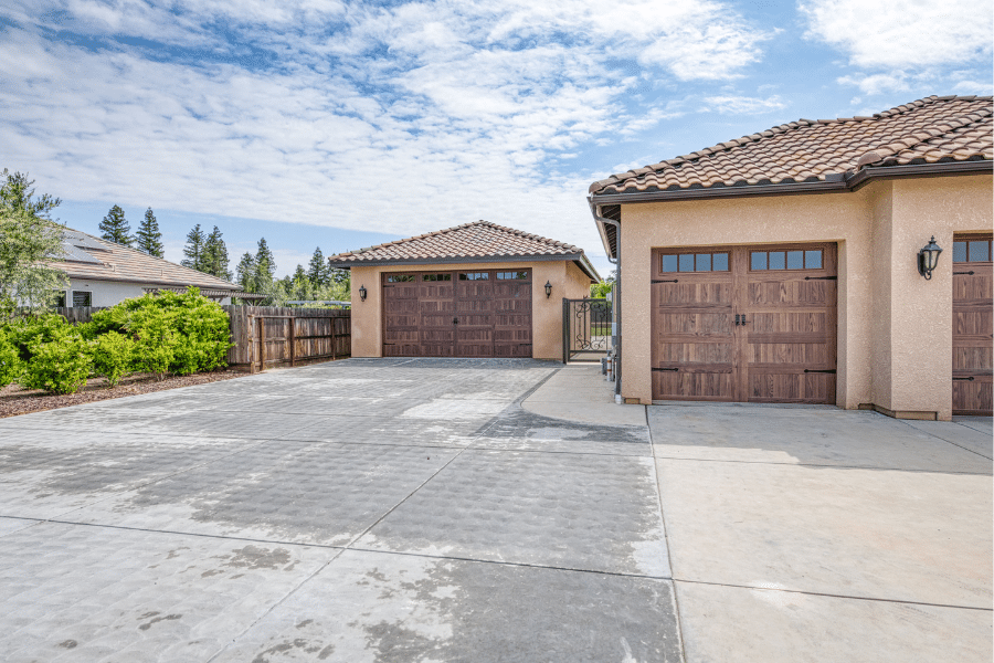 22x34 Garage with Spanish Tile roof beside matching attached garage