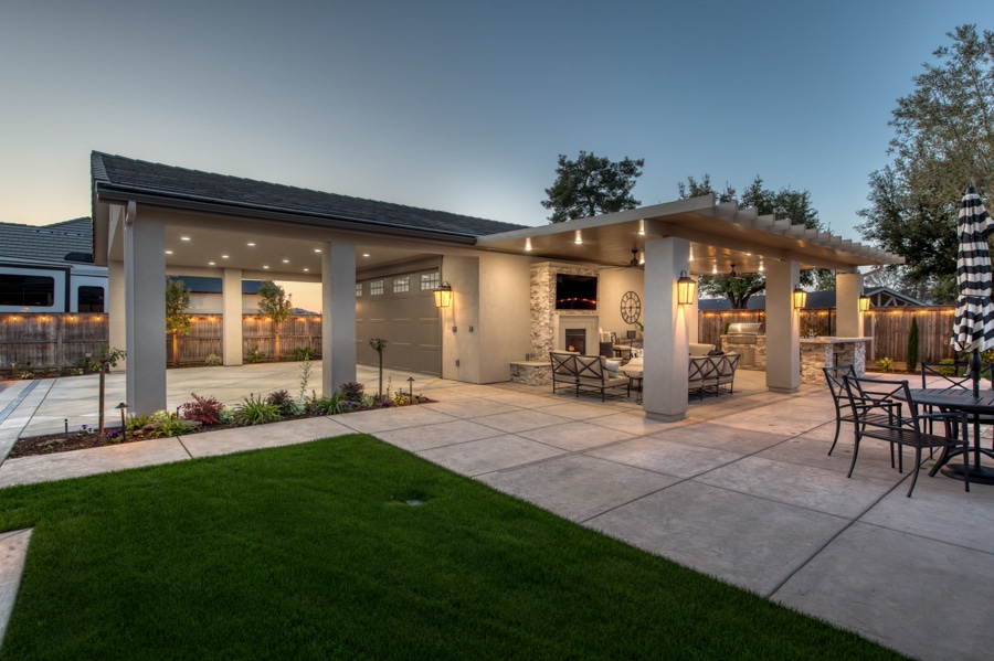 30x50 garage with attached patio area lit up at night