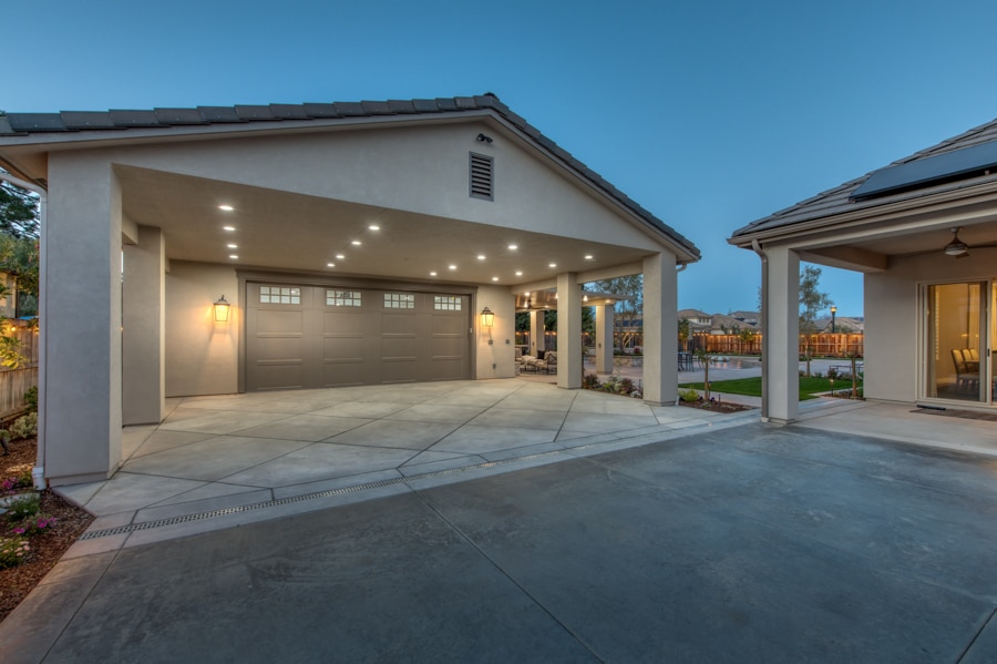 30x50 garage with patio lit up at night