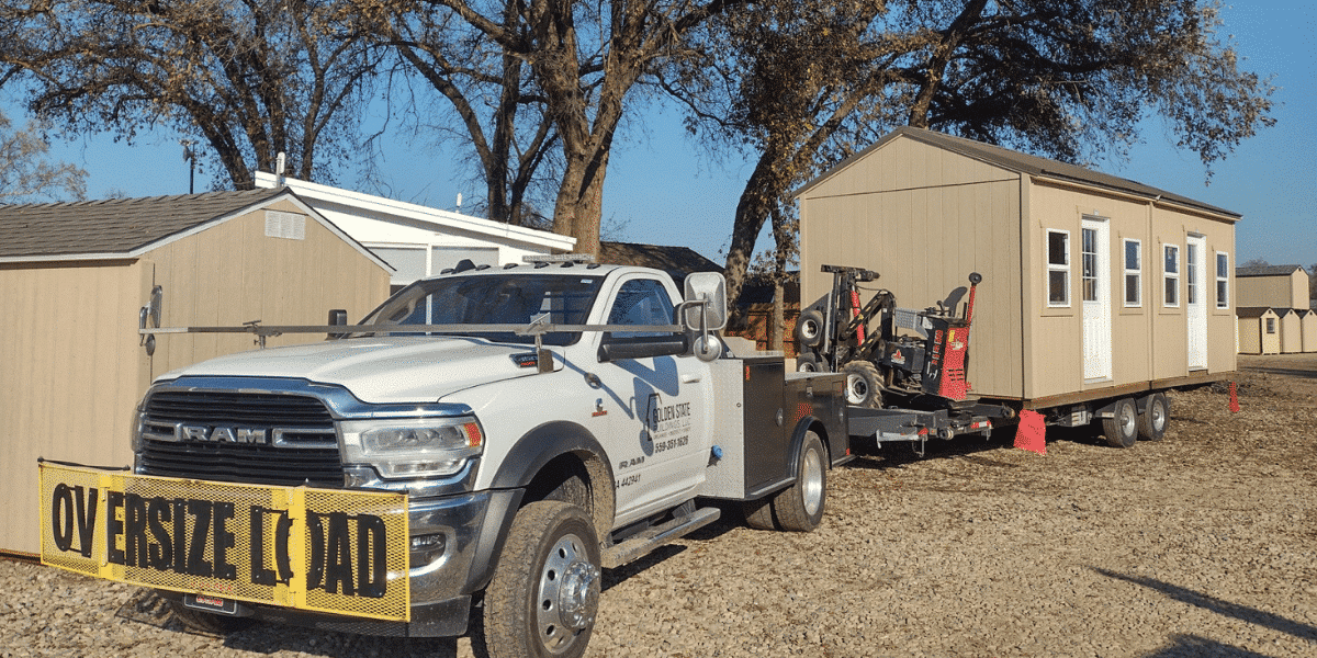 Truck delivering prefab sheds