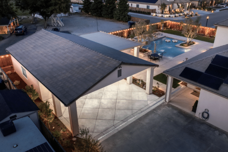 aerial view of backyard pool pavilion and garage combo