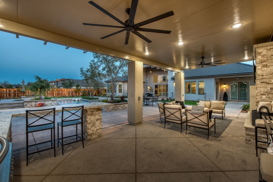 attached patio seating area lit up at night