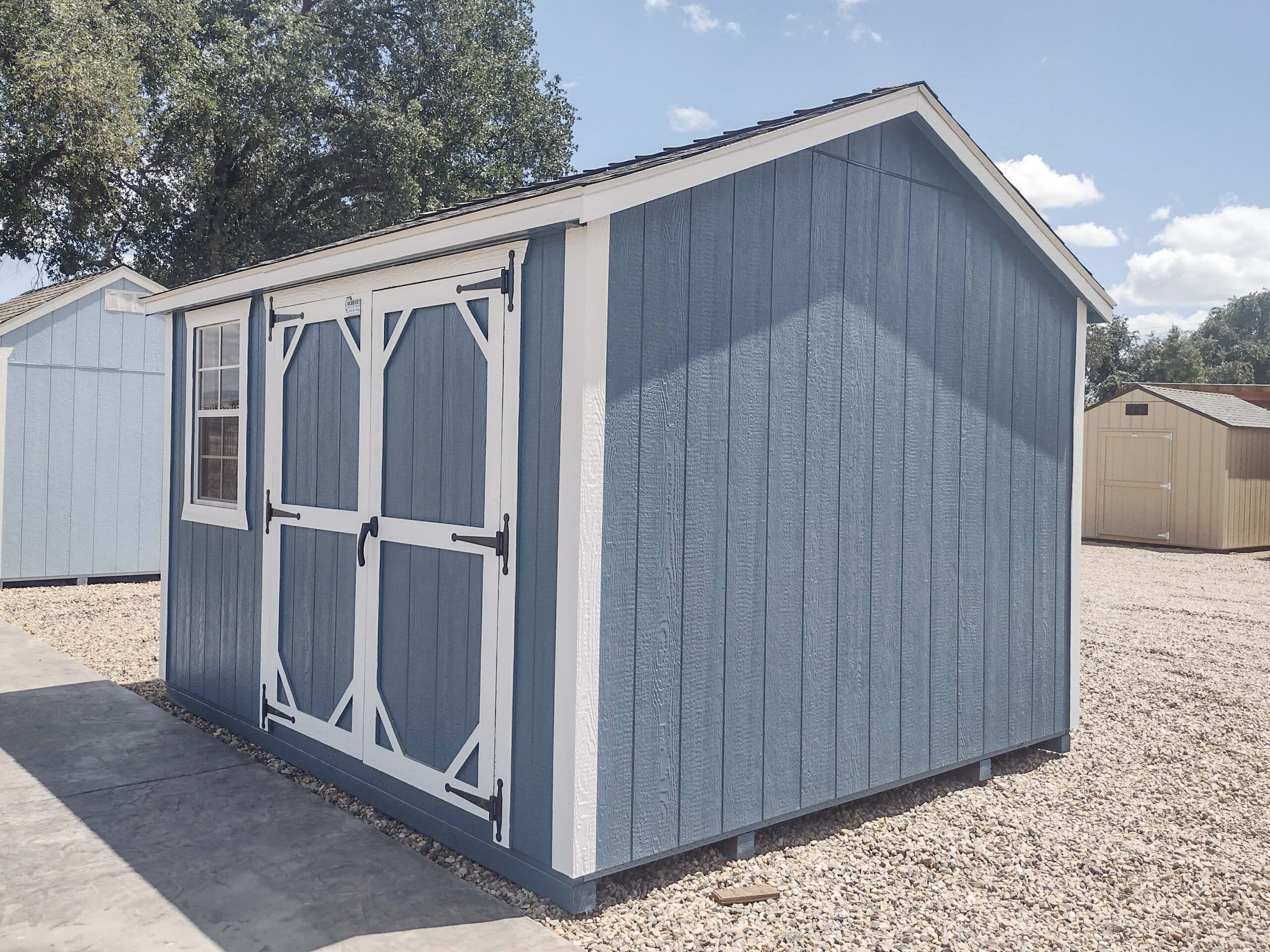 blue and white trimmed ranch elite sheds near Lemoore CA
