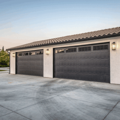 beige three car garage with brown garages in friant ca