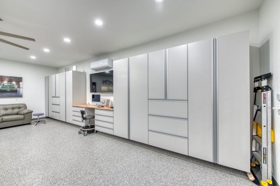 cabinets inside 30x50 garage with split unit and featuring attached patio