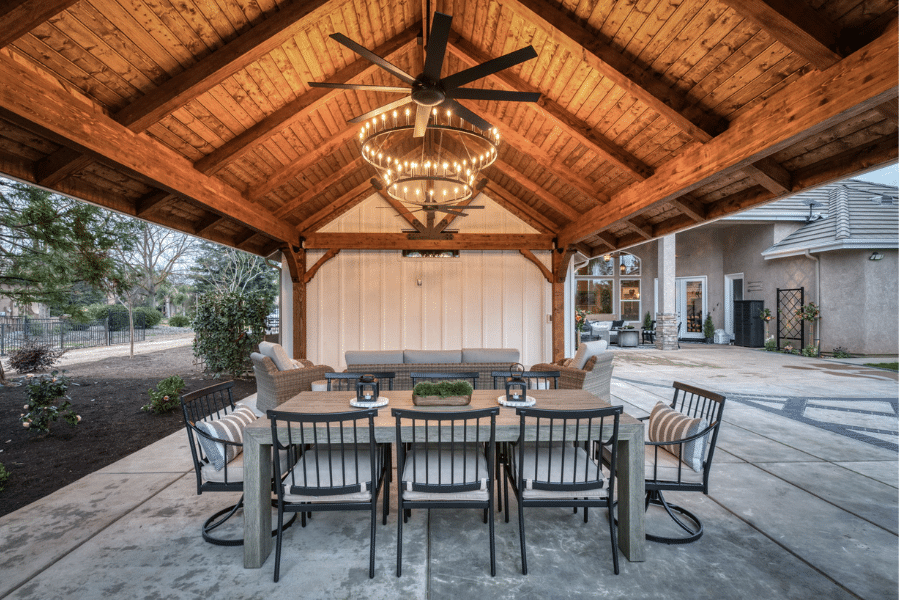 chandelier lit up over outdoor dining table in Clovis, CA