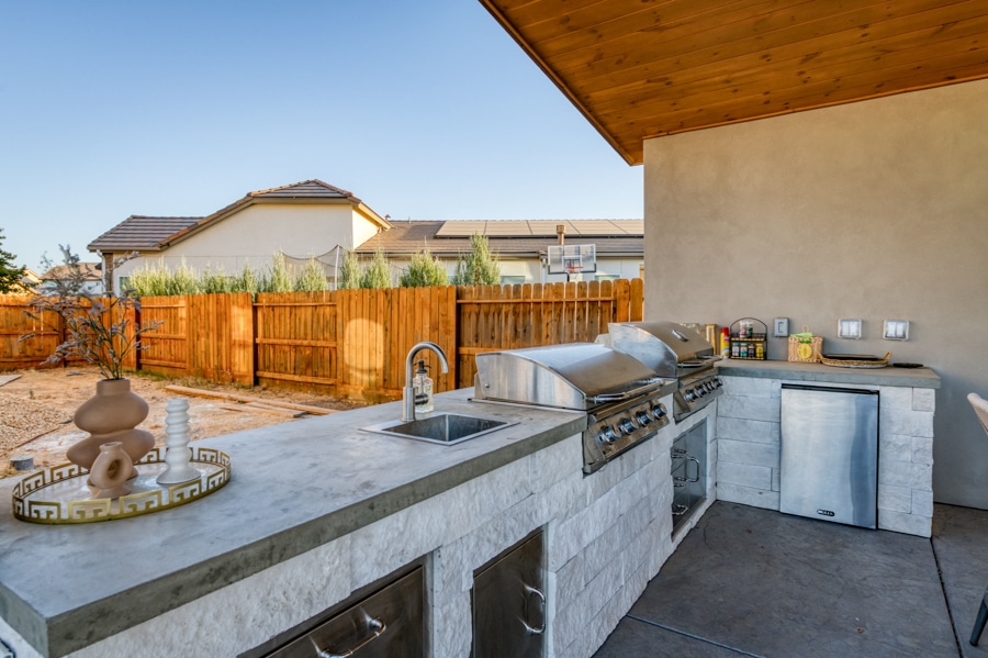 close up of countertops and grill area of outdoor kitchen in 20x26 poolside cabana
