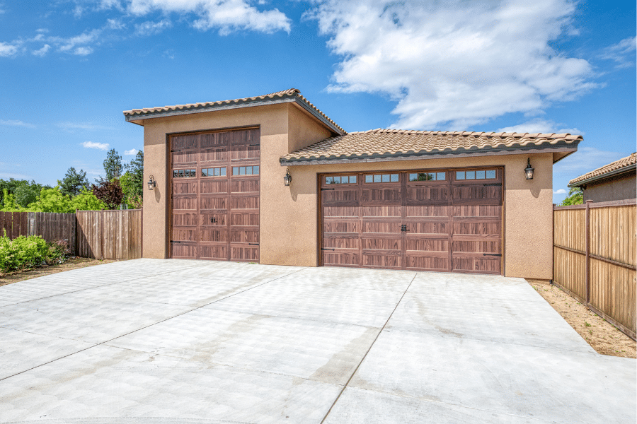 close up of three-vehicle 32x40 garage with spanish tile roofing