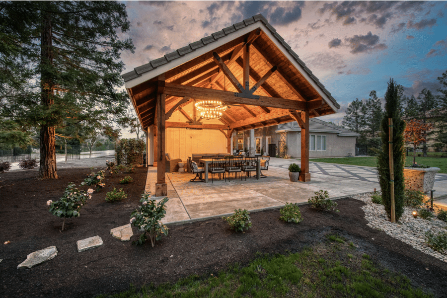 concrete pavers through garden leading to 17x23 timber frame pavilion and concrete patio