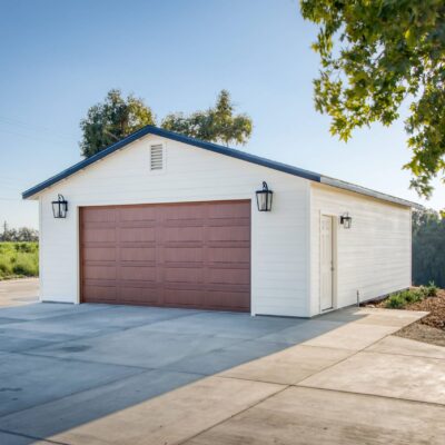cream colored one car garage with brown garage door