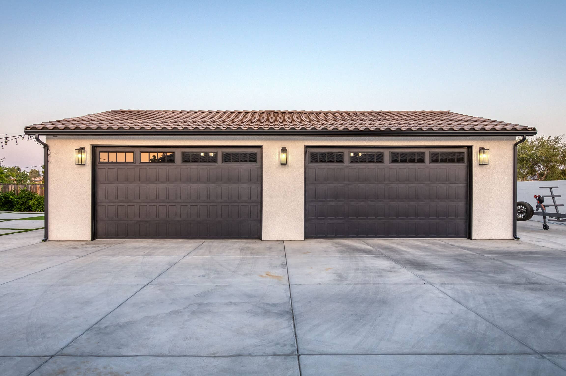 custom four car garages near Shaver Lake CA with two brown overhead doors