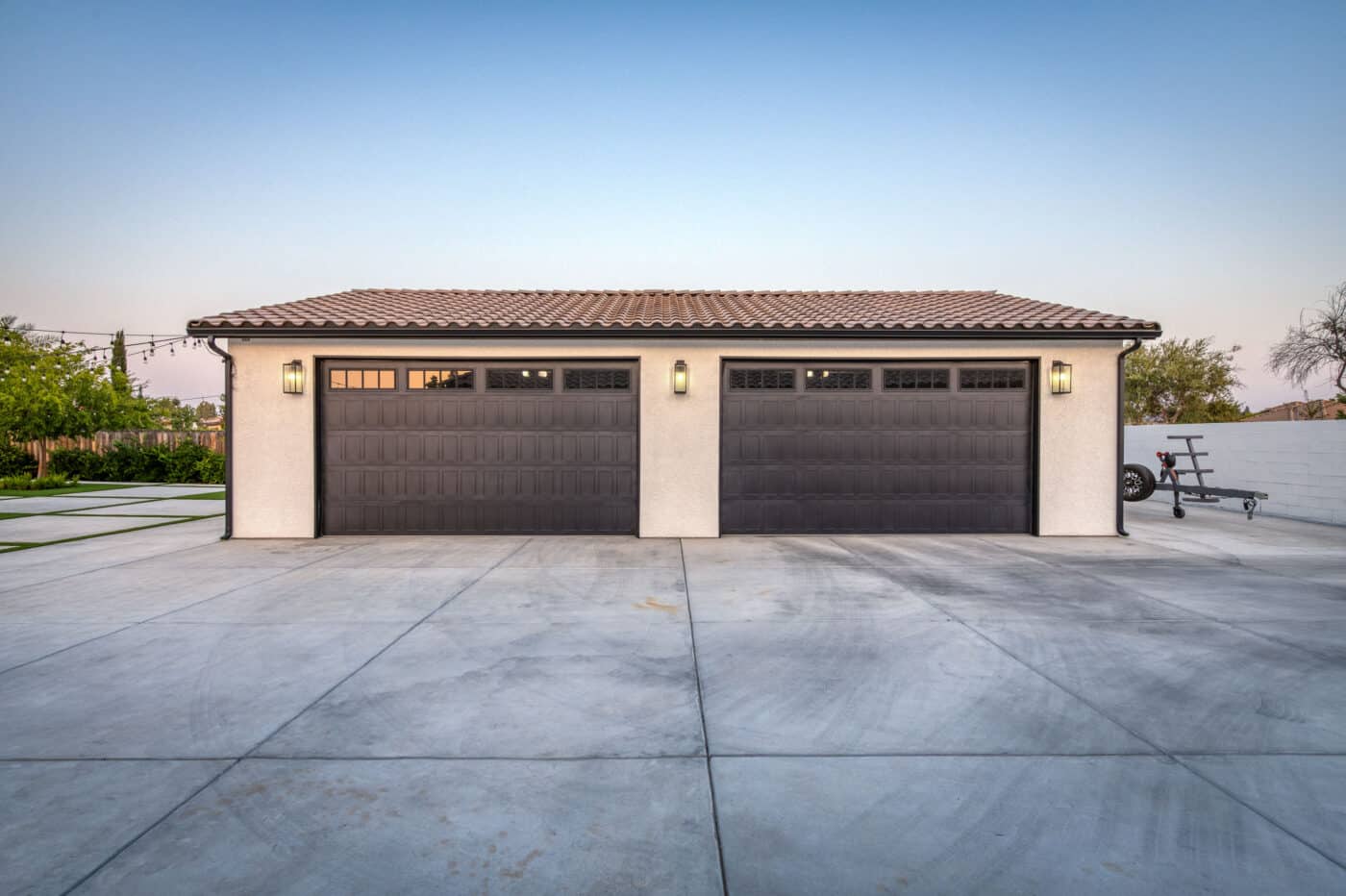 tan custom garage in Fresno CA with two brown garage doors