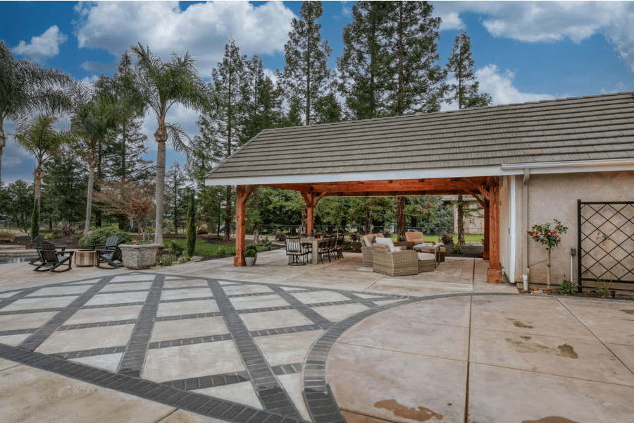 custom gray roofing on 17x23 timber frame pavilion over concrete patio