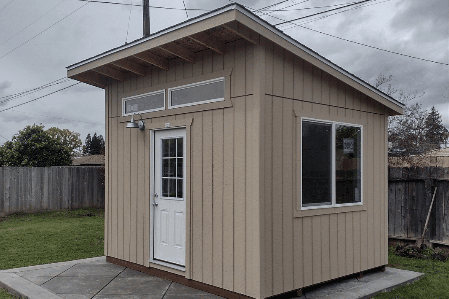 custom tan lean to shed on concrete pad