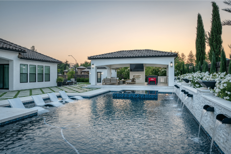 custom white pavilion by pool with TV seating area and kitchen in Squaw Valley CA