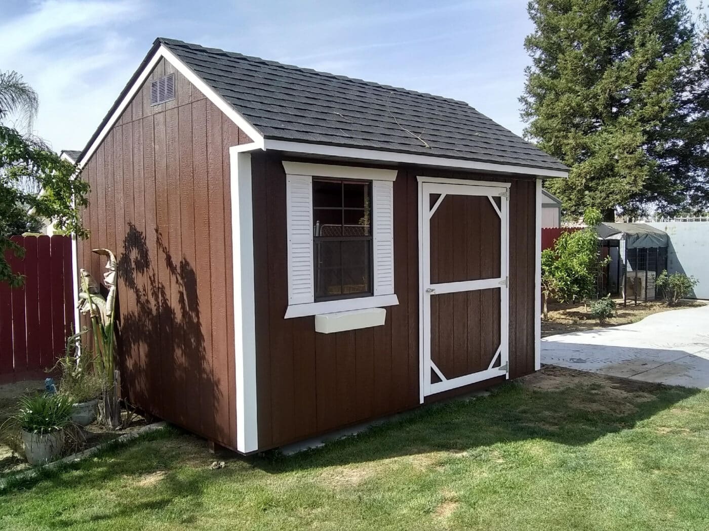 dark red and white trimmed rent to own sheds near Shaver Lake CA