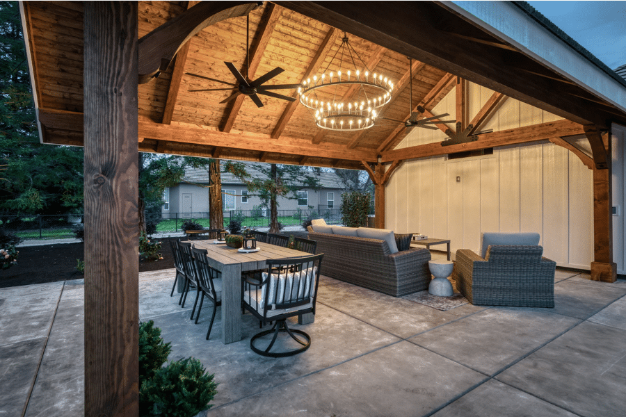 dining table and seating area under 17x23 timber frame pavilion