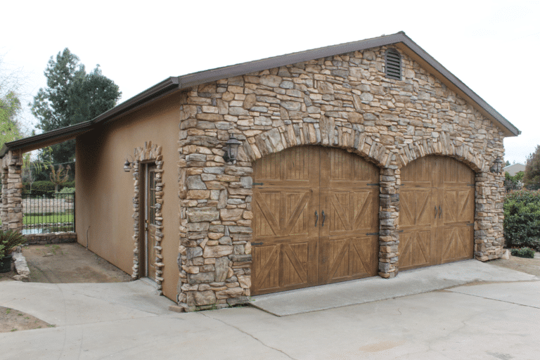 brown garage with stone and two doors in dunlap ca