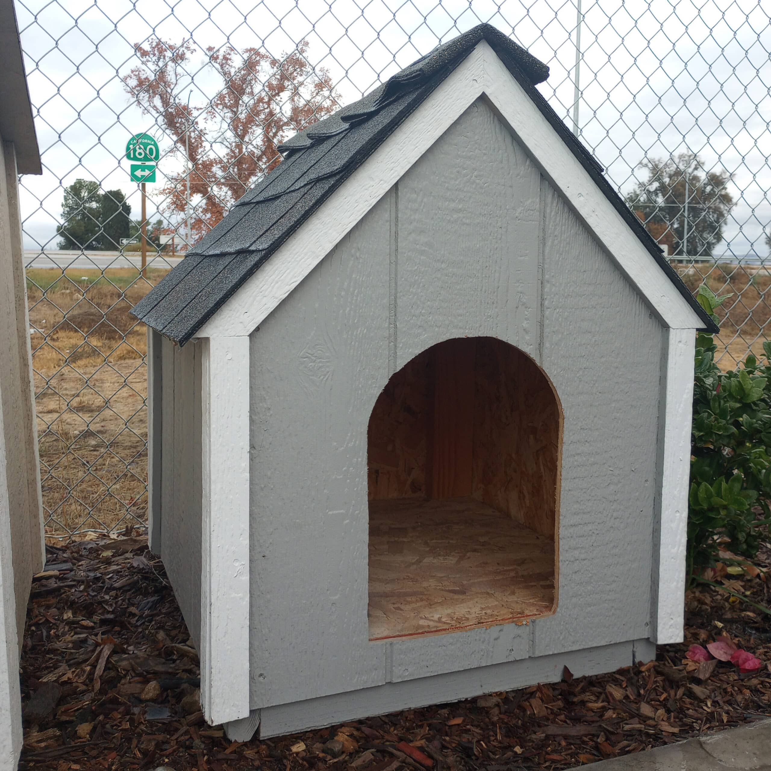 gray and white trimmed dog house