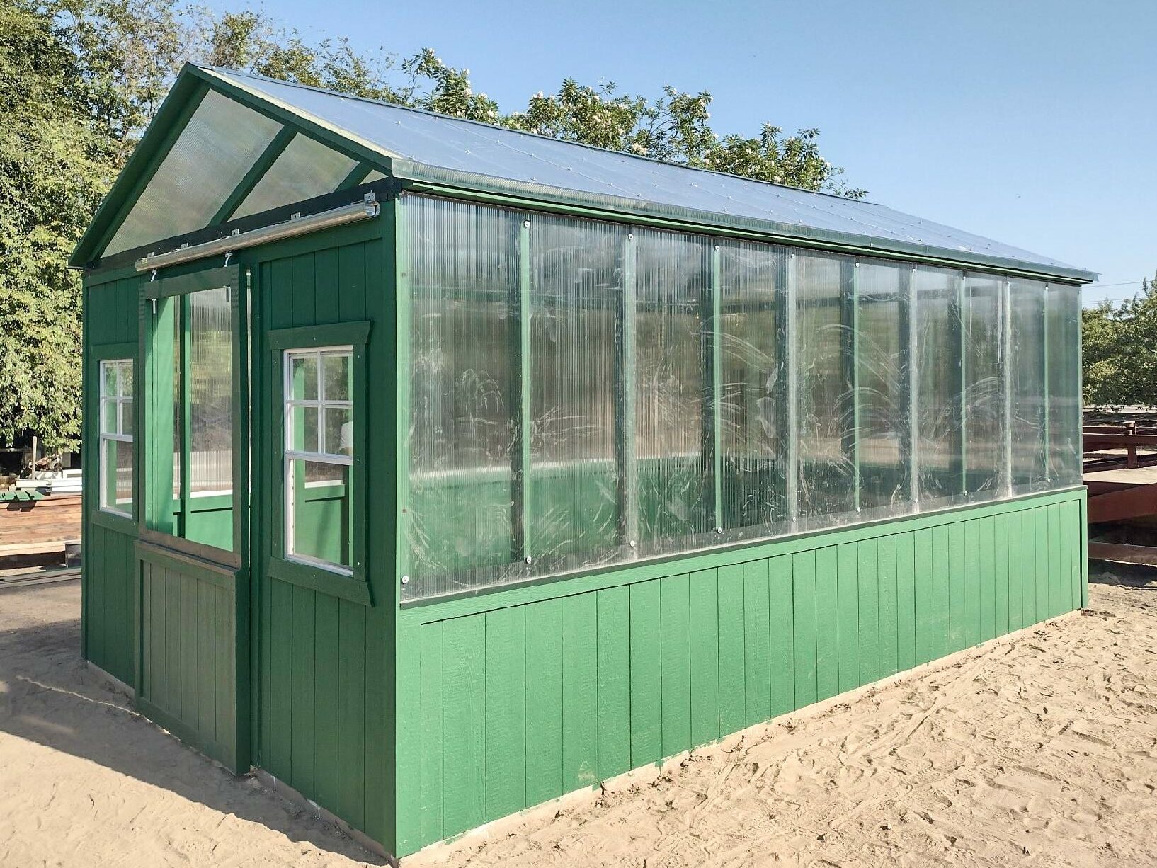 green and clear sided custom sheds near Reedley CA