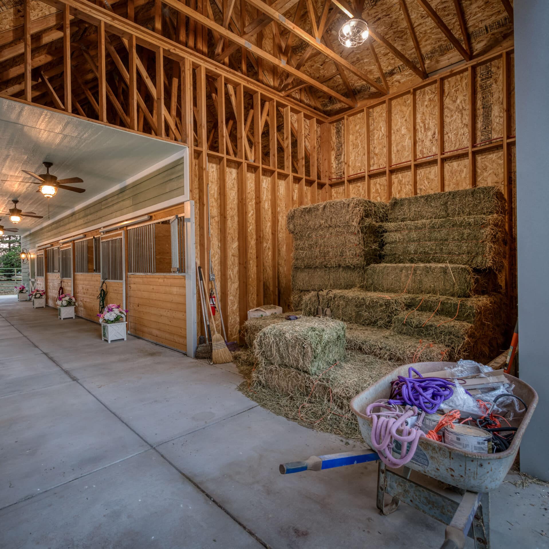 green horse barn with hay storage room
