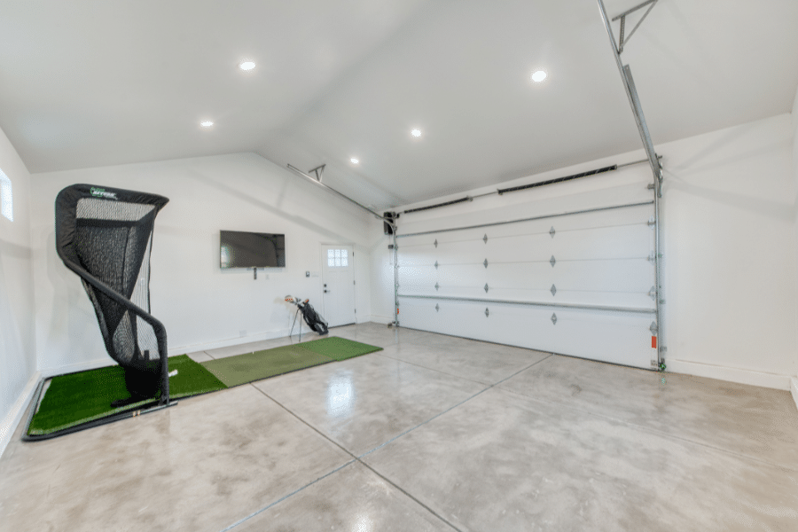 interior of 20x24 2-car garage with golf simulator