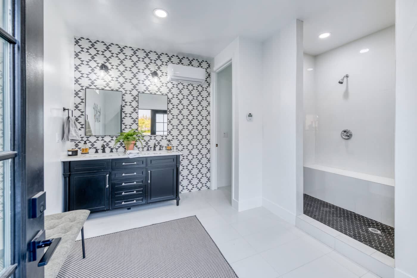 interior of custom cabana with bathroom sinks and shower