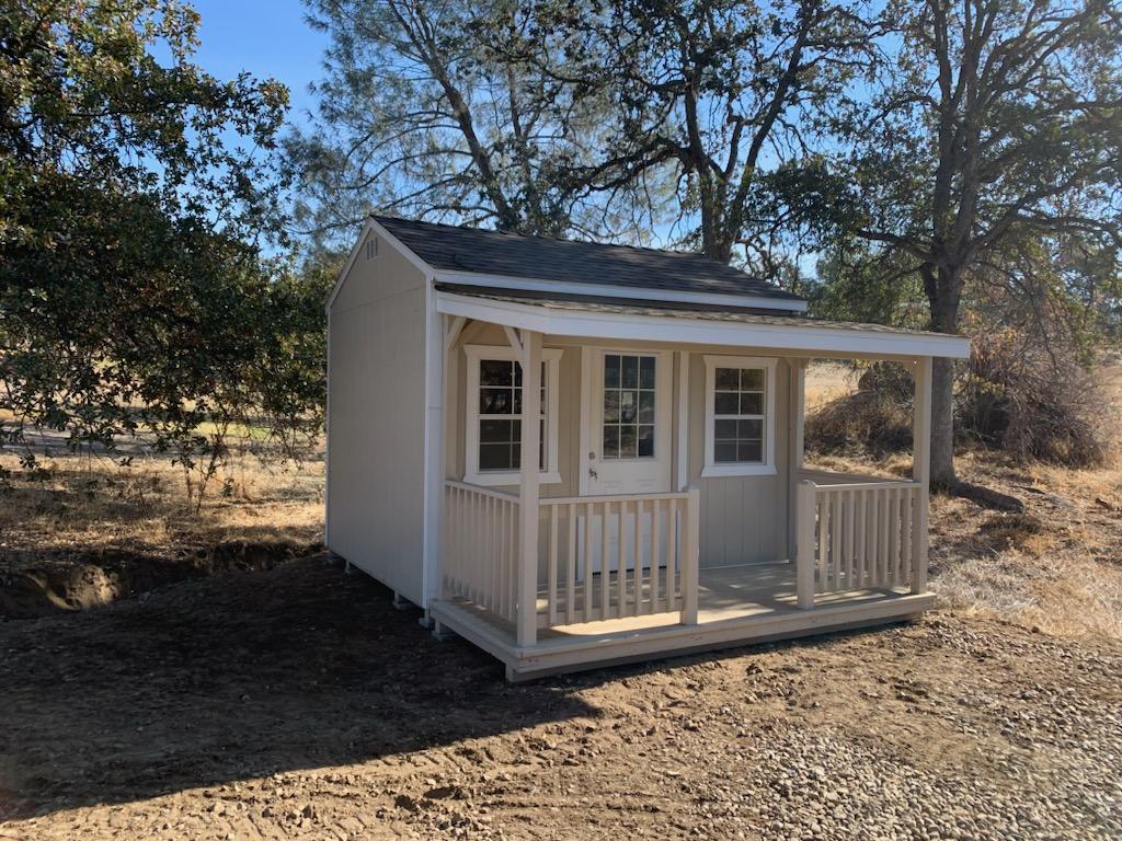 light gray cottage sheds near Coarsegold CA with front porch