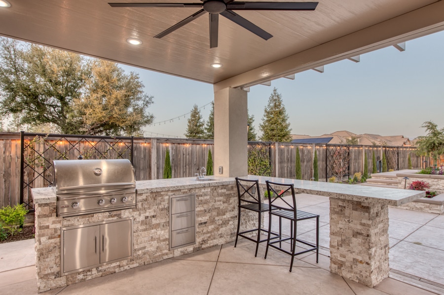 outdoor kitchen on patio beside 30x50 garage