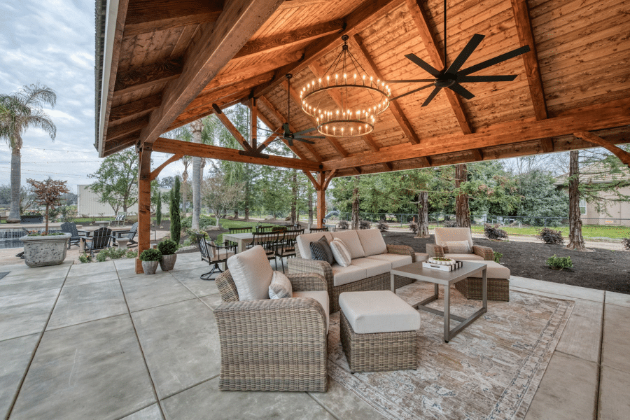 outdoor seating area under 17x23 timber frame pavilion in Clovis, CA