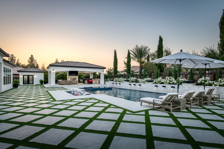 pavilion by pool with outdoor seating area and TV