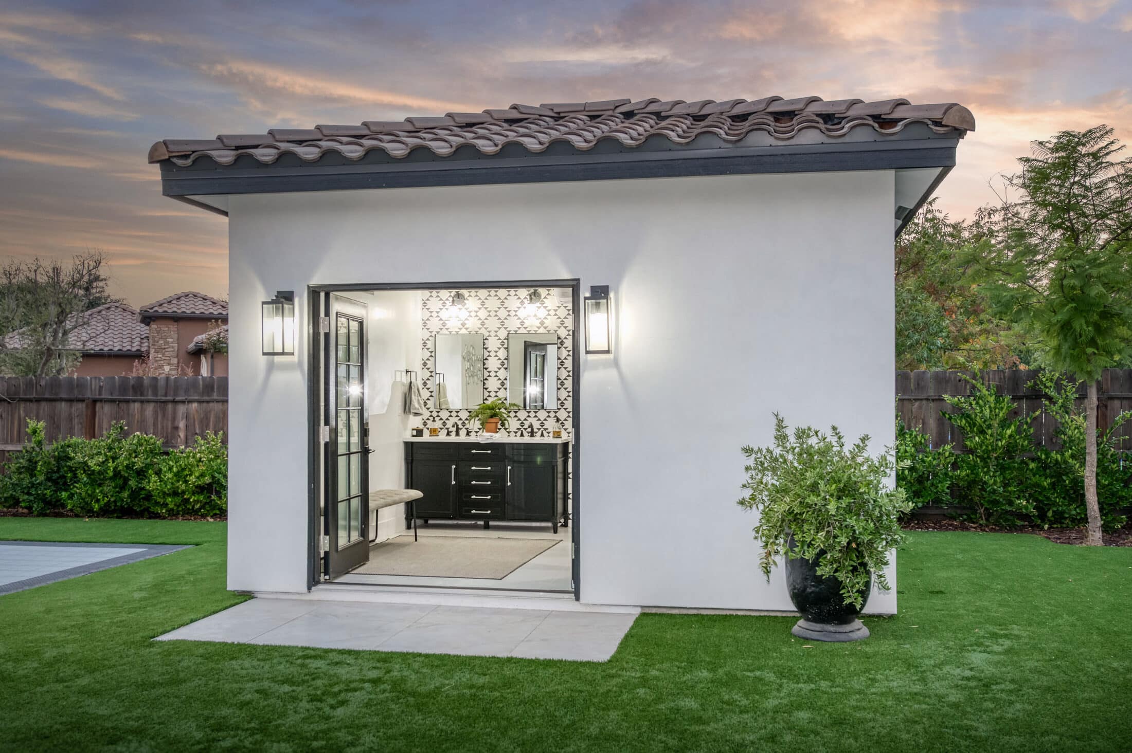 white poolside cabana shower and bath house in Visalia CA with door open leading to inside