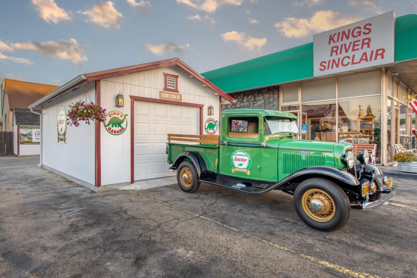 red and white trimmed one car garage with green truck parked out front