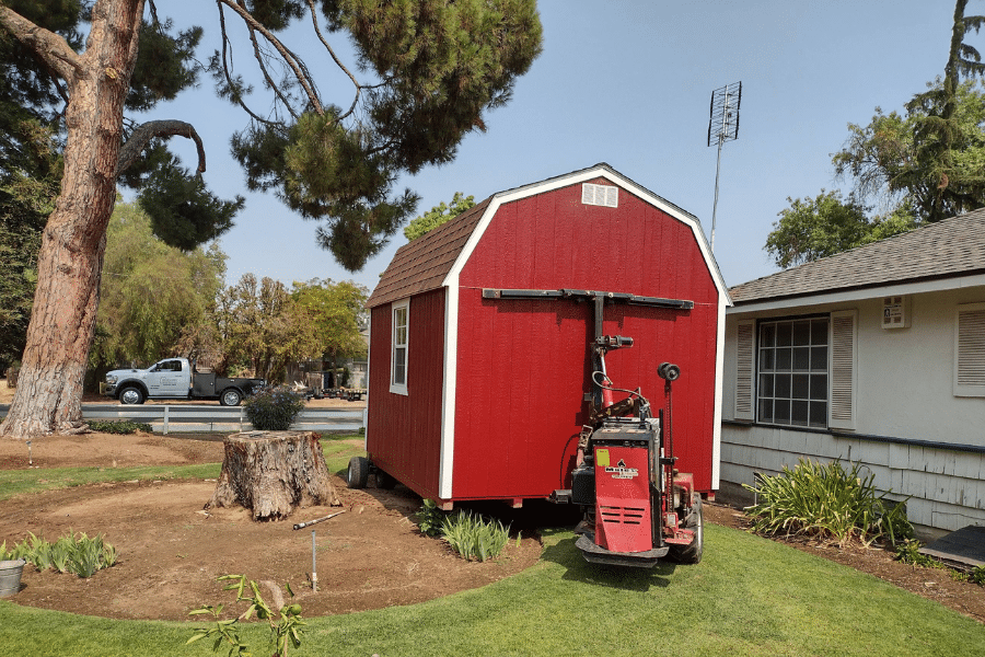 red barn style shed being delivered to property in Exeter CA