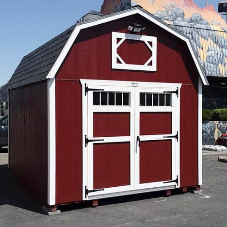 red elite barn style shed with white trim and black shingle roof