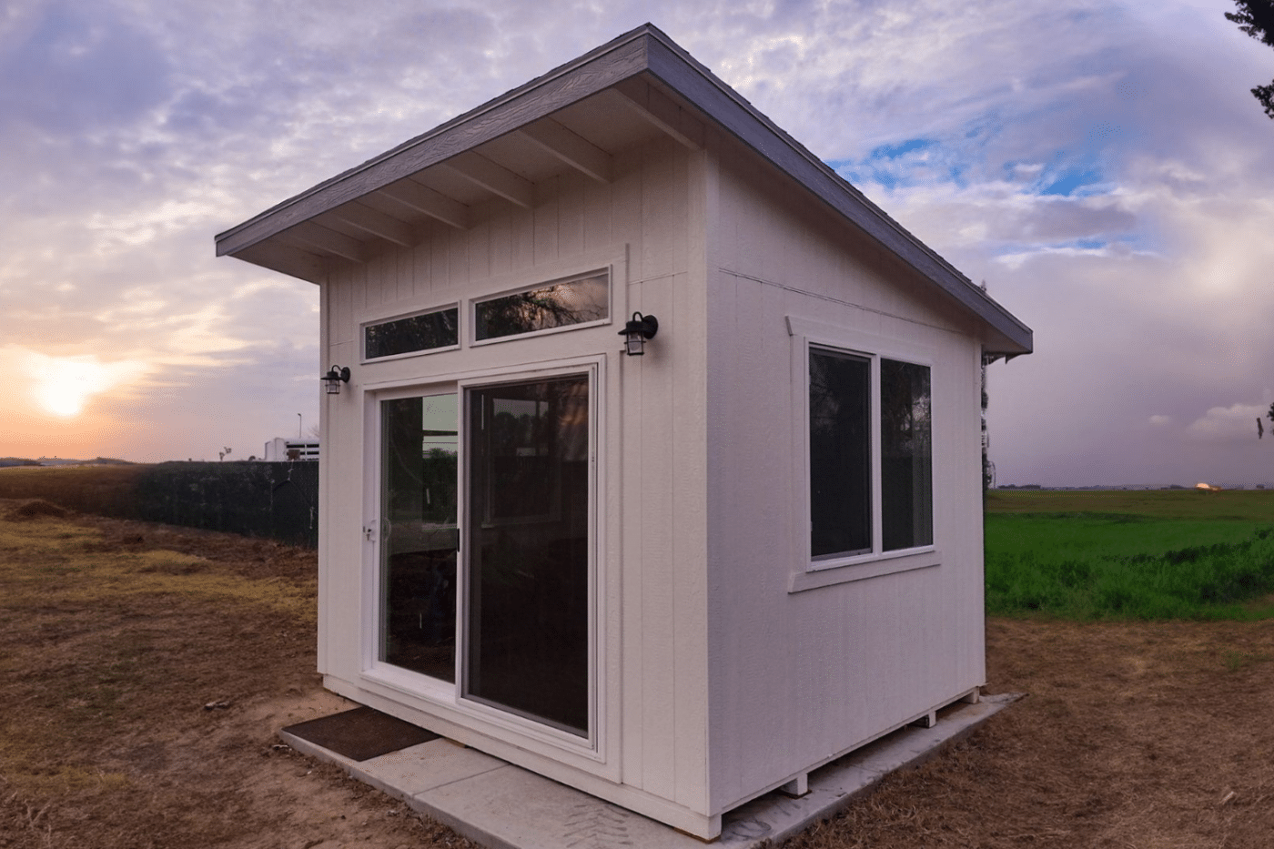 lean to white shed in field in kerman ca
