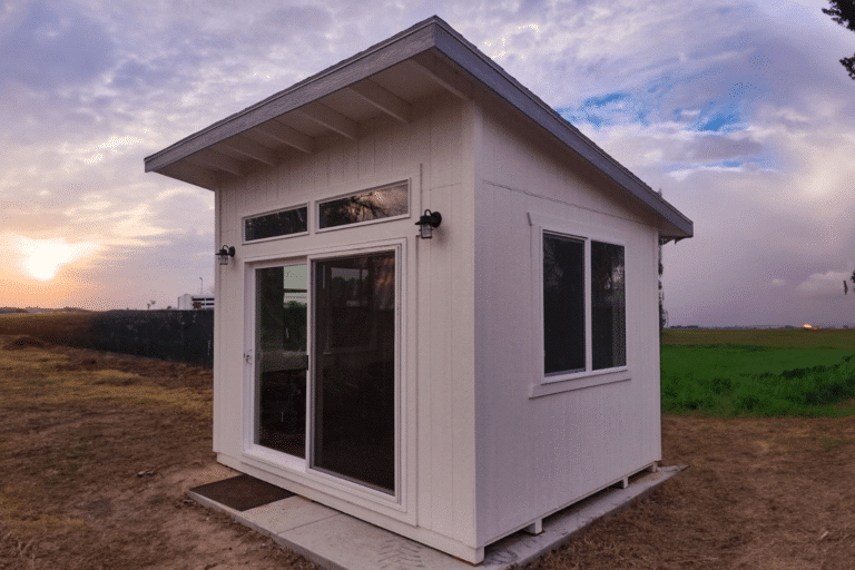 lean to white shed in field in kerman ca