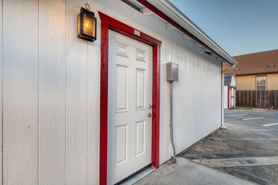 side door on white and red trimmed 14x20 garage in reedley, CA