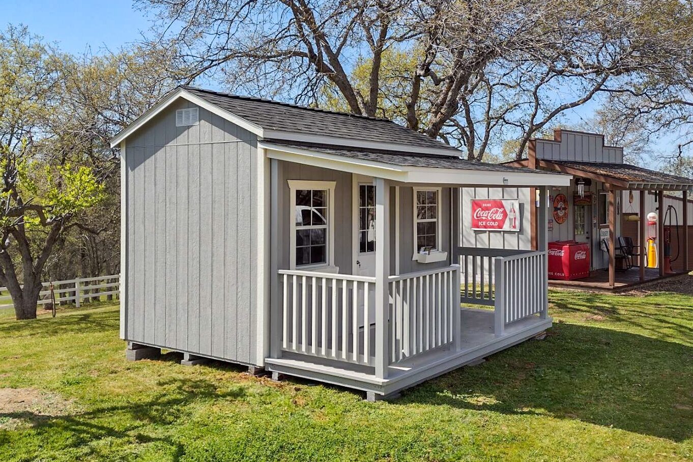 side of gray shed with front porch