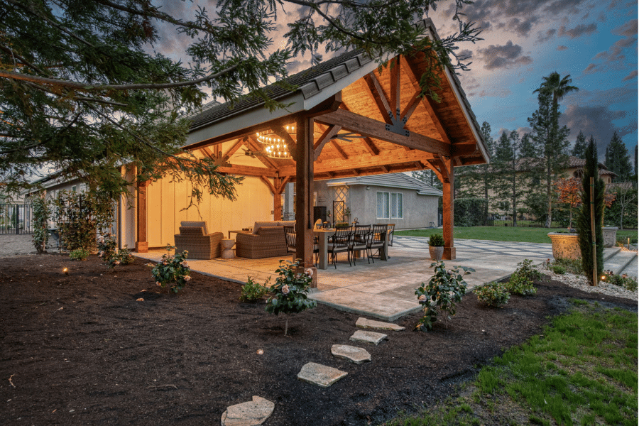side view of concrete pavers leading through garden to 17x23 timber frame patio in Clovis, CA
