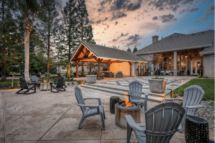 side view of patio with fire pit and 17x23 timber frame pavilion in Clovis, CA
