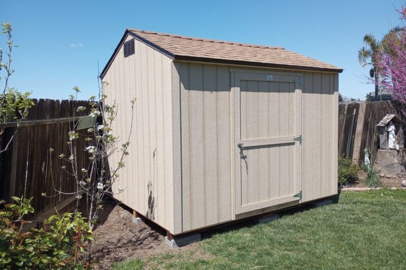 tan value shed along fence