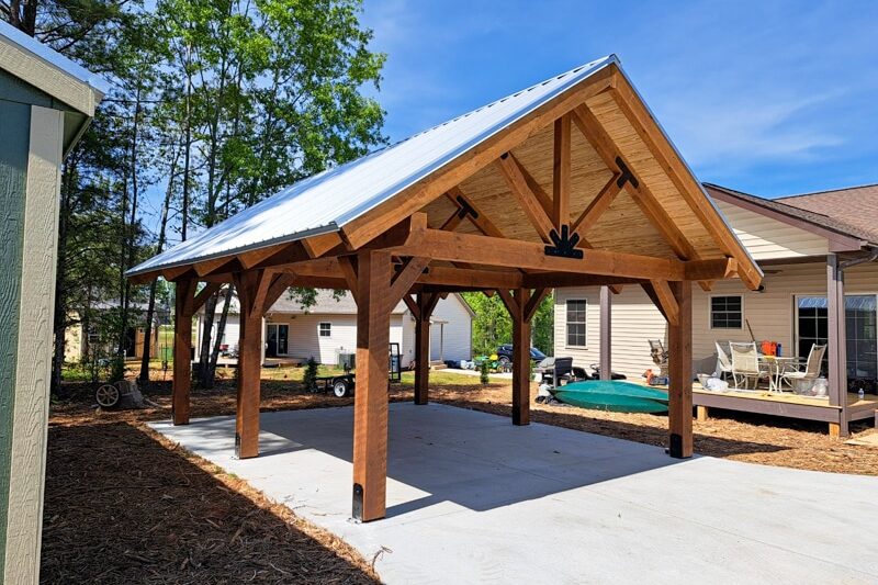 timber frame pavilion over patio area with space for hot tub