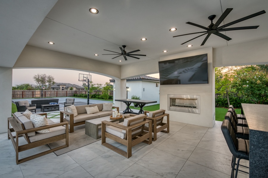 underside of poolside 20x30 cabana with patio featuring seating area, TV, lighting, and fans
