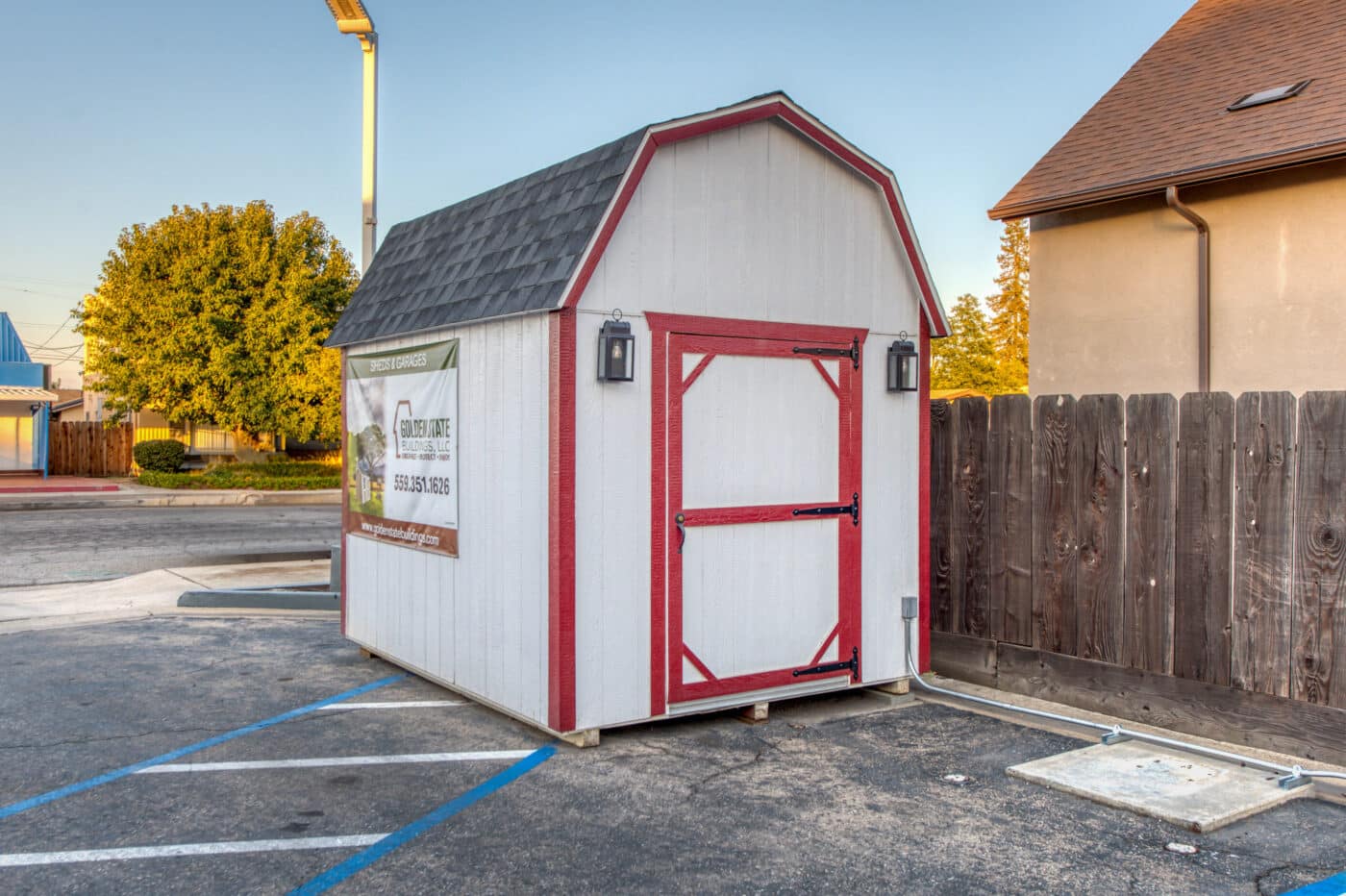 white and red trimmed barn style shed